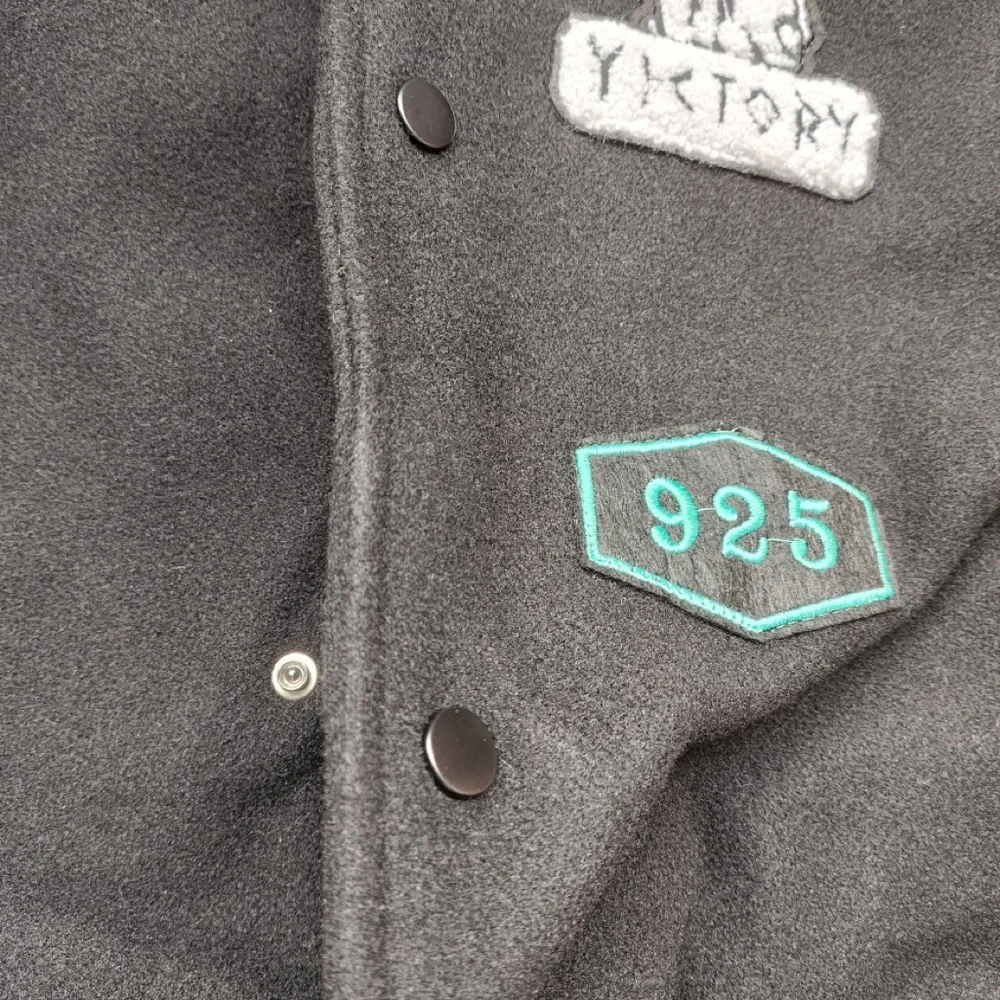 Nike Black Varsity Jacket with Mint Accents